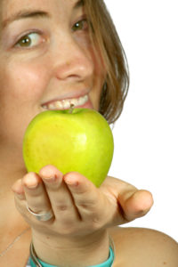 apple in green offered by a fitness instructor